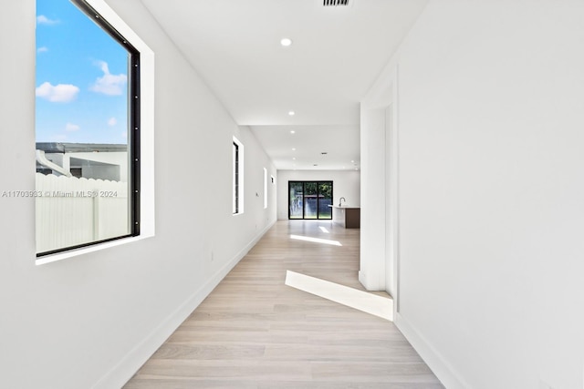 hallway with light wood-type flooring