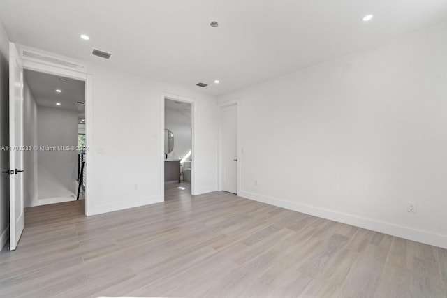 unfurnished bedroom featuring light wood-type flooring