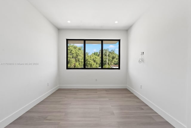 empty room with light hardwood / wood-style floors