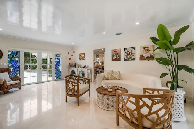 sitting room with french doors, light tile patterned floors, and crown molding