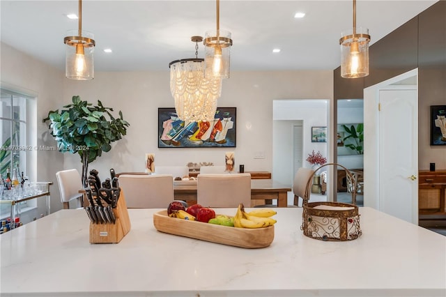 interior space with hanging light fixtures and an inviting chandelier