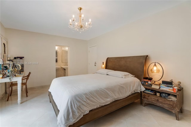 bedroom with a chandelier and ensuite bath