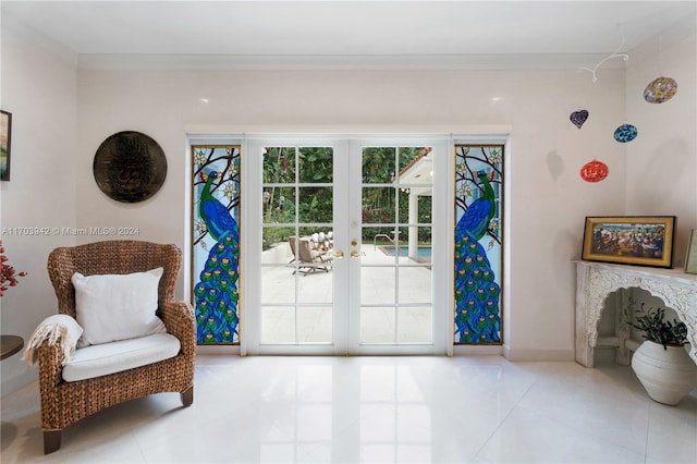 sitting room featuring light tile patterned flooring, ornamental molding, and french doors