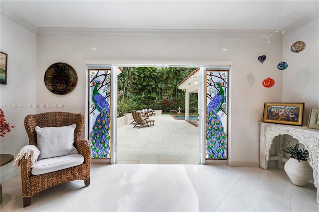 interior space with light tile patterned floors and crown molding