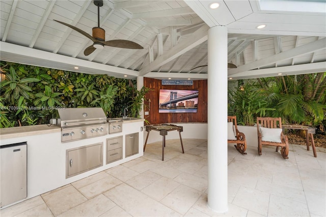 view of patio with a gazebo, a grill, ceiling fan, and exterior kitchen