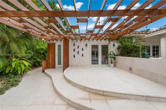 view of patio featuring french doors and a pergola