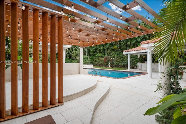 view of swimming pool featuring a pergola and a patio area