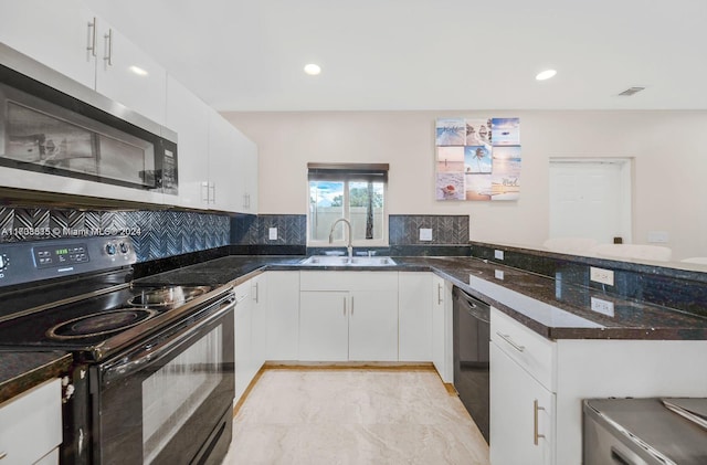 kitchen featuring black appliances, white cabinets, sink, decorative backsplash, and dark stone countertops