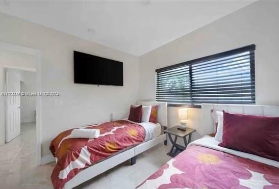 bedroom featuring light colored carpet