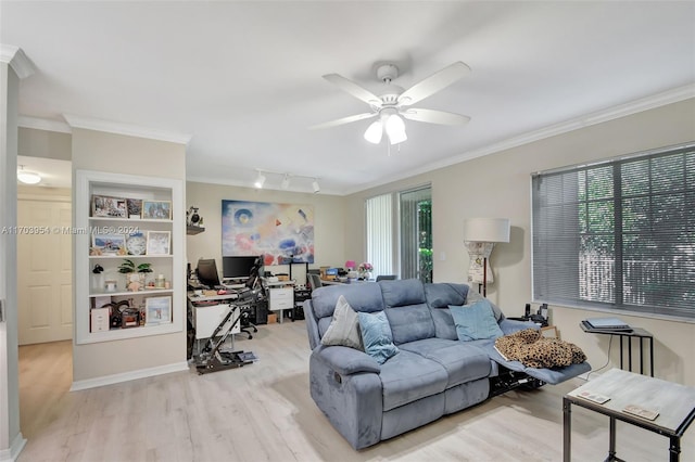 living room featuring ceiling fan, light hardwood / wood-style flooring, a healthy amount of sunlight, and ornamental molding