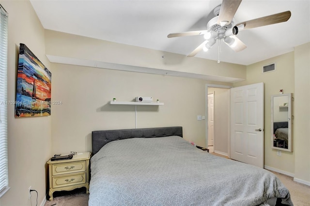 bedroom featuring ceiling fan and carpet floors