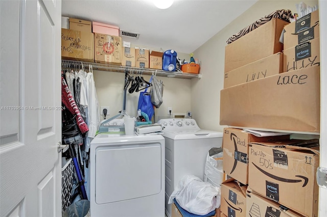 clothes washing area featuring washer and clothes dryer