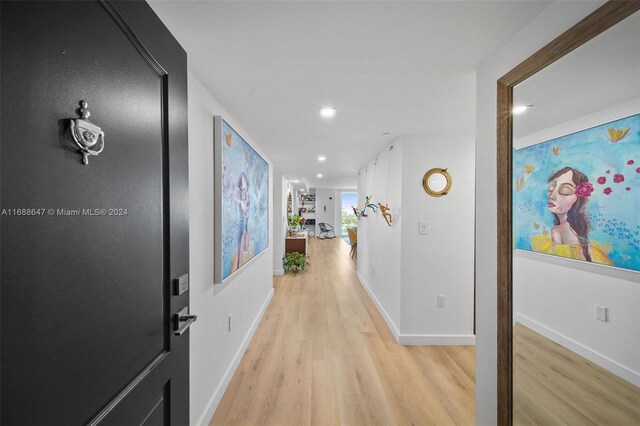 hallway featuring light hardwood / wood-style flooring