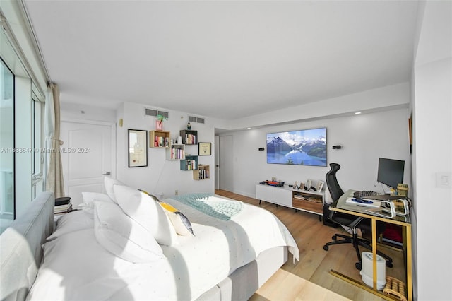 bedroom featuring hardwood / wood-style flooring