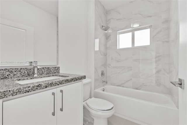 full bathroom featuring tile patterned floors, vanity, toilet, and tiled shower / bath