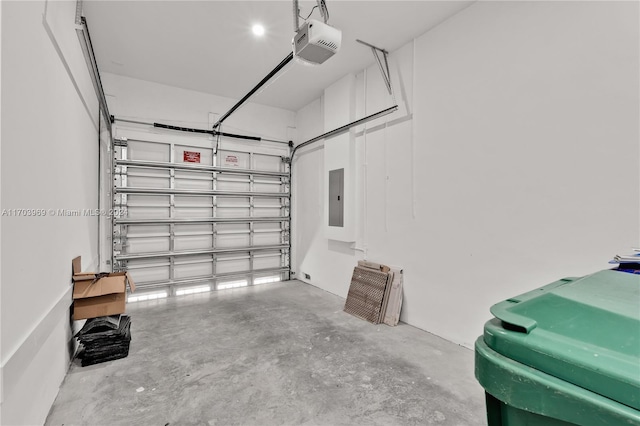 garage with electric panel and a garage door opener