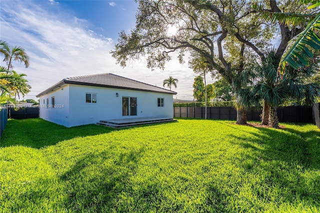 back of house with a yard