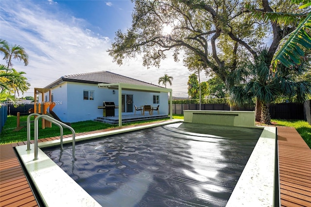 exterior space with a playground and grilling area