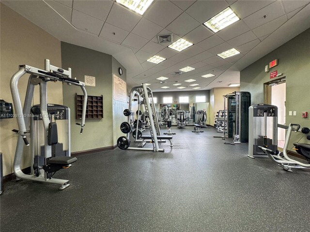 gym featuring a paneled ceiling