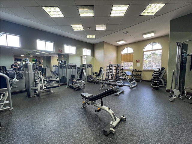 workout area featuring a paneled ceiling