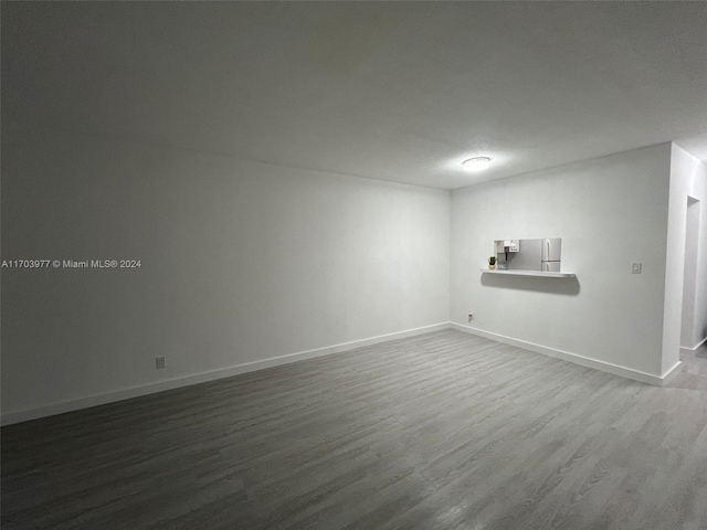 empty room with wood-type flooring