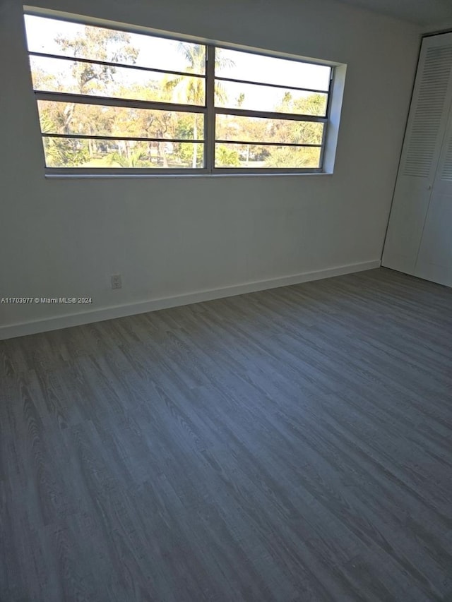 spare room featuring dark hardwood / wood-style floors