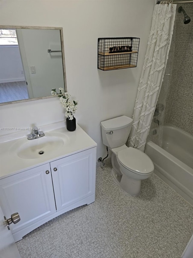 full bathroom with vanity, shower / bathtub combination with curtain, and toilet