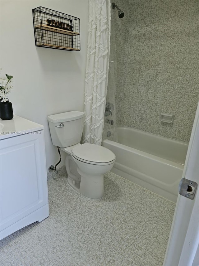 bathroom with shower / bath combination with curtain and toilet