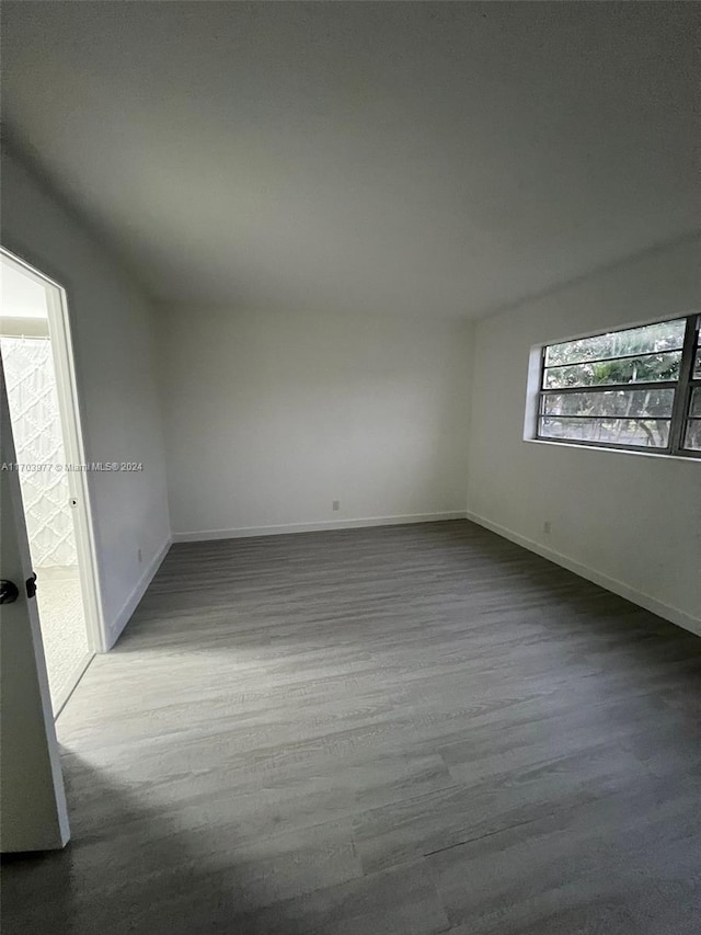 empty room with wood-type flooring