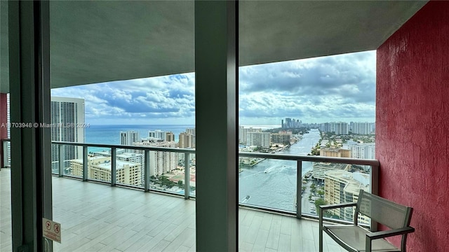 balcony featuring a water view