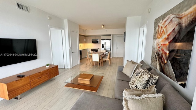 living room featuring light wood-type flooring