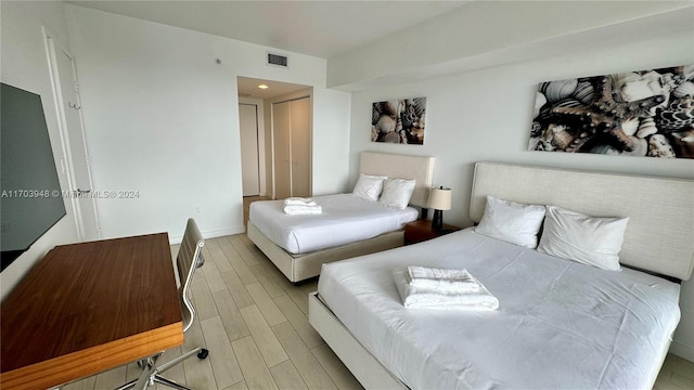 bedroom with wood-type flooring