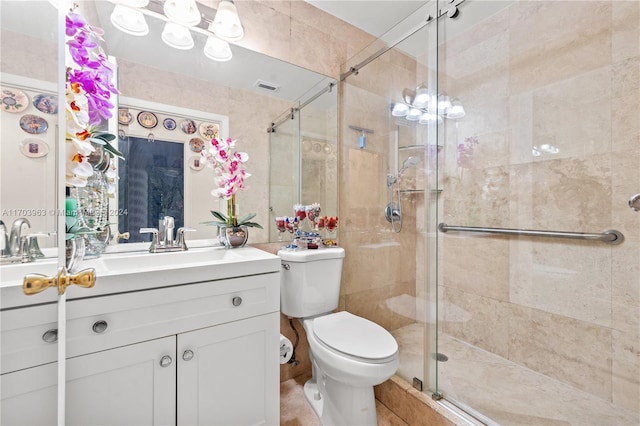 bathroom featuring vanity, toilet, and walk in shower