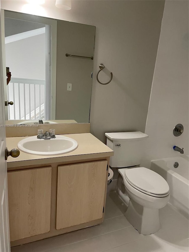 full bathroom with bathing tub / shower combination, tile patterned flooring, vanity, and toilet