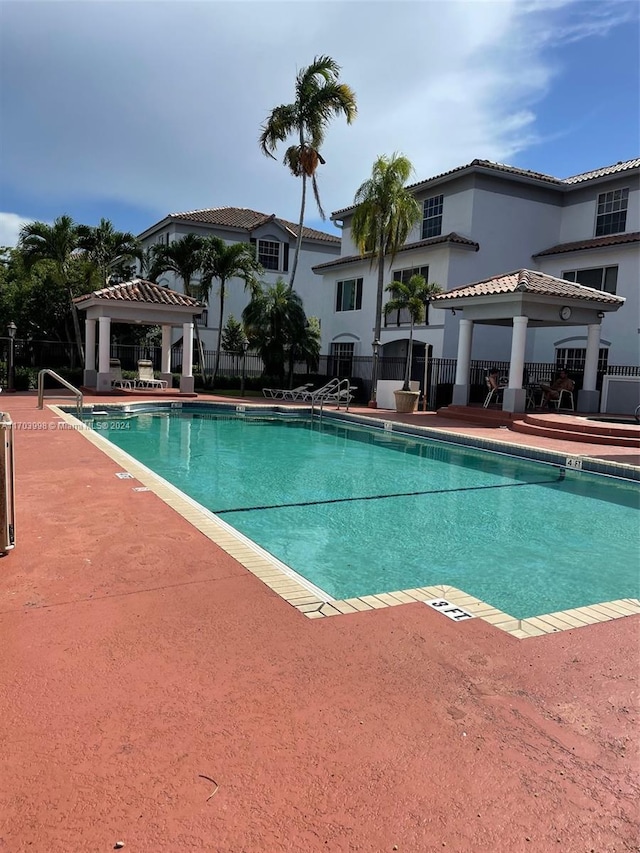 view of swimming pool with a gazebo and a patio