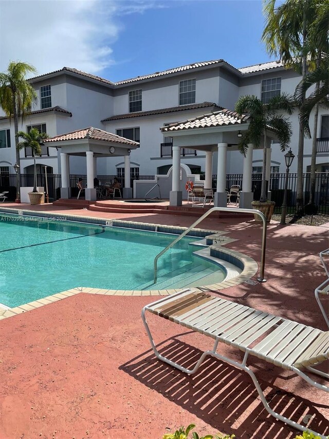 view of swimming pool with a patio area
