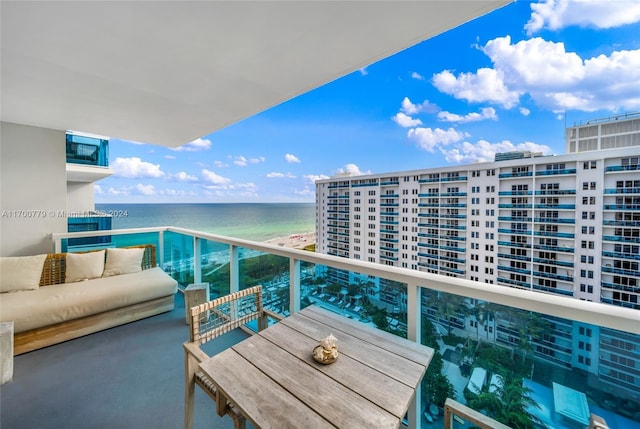 balcony with outdoor lounge area and a water view