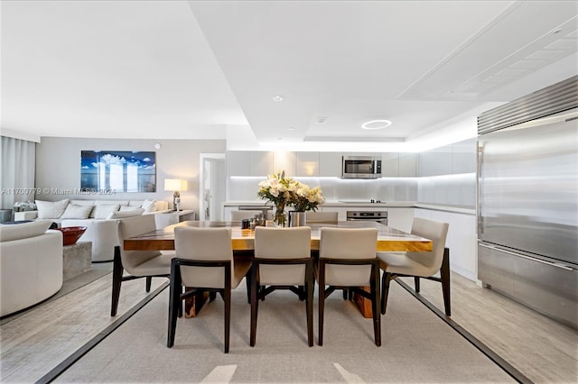 dining room with light hardwood / wood-style flooring