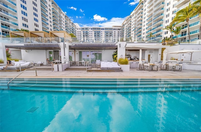 view of pool featuring an outdoor hangout area and a patio area