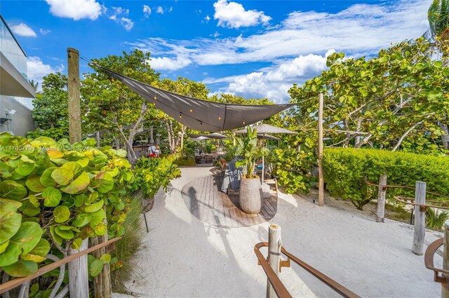 view of property's community with a patio