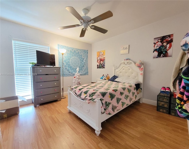 bedroom with ceiling fan and light hardwood / wood-style flooring