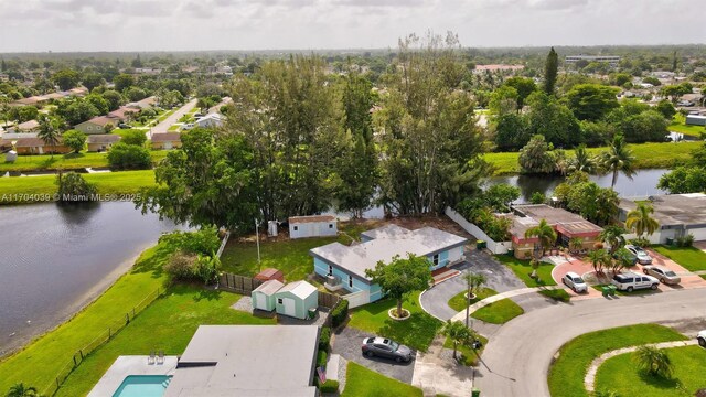birds eye view of property featuring a water view and a residential view