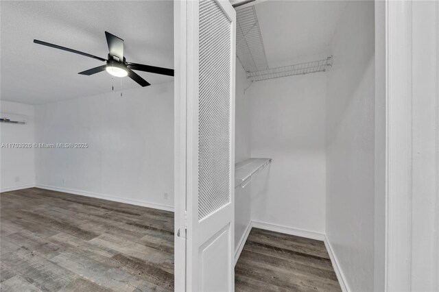 living room with wood-type flooring and a textured ceiling