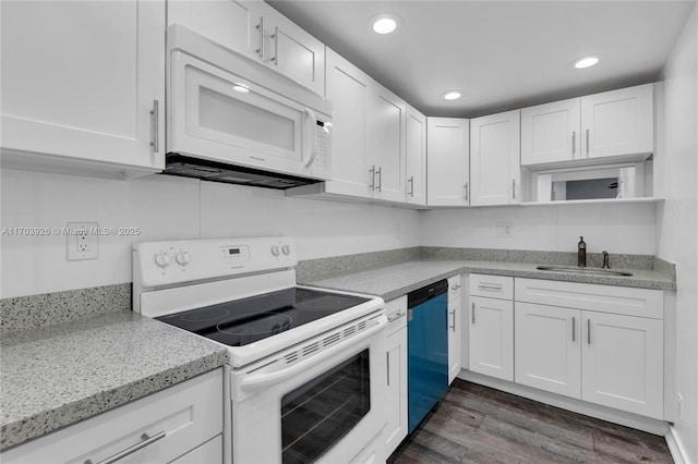 kitchen with sink, white appliances, light stone countertops, and white cabinets