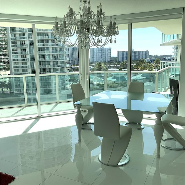 dining room featuring tile patterned flooring and an inviting chandelier