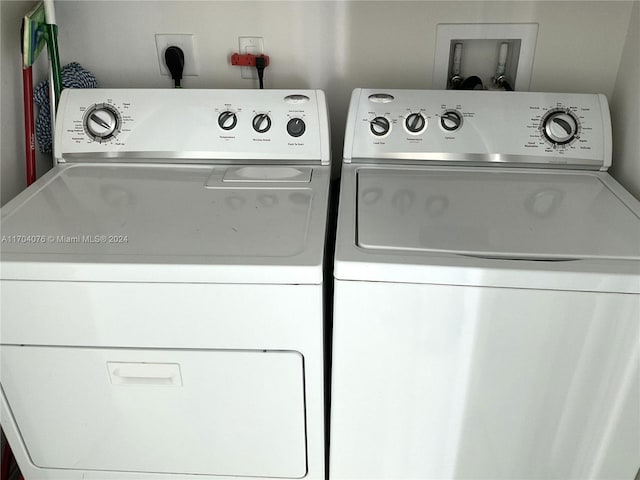 laundry room featuring separate washer and dryer