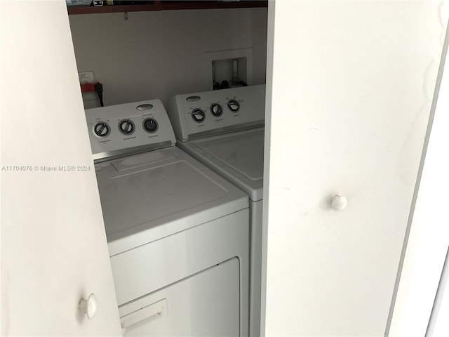 clothes washing area featuring washer and clothes dryer