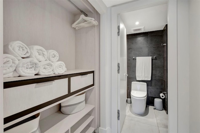 bathroom featuring tile patterned flooring and toilet