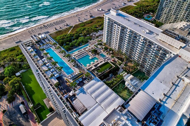 drone / aerial view with a water view and a view of the beach