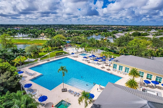 view of swimming pool featuring a water view